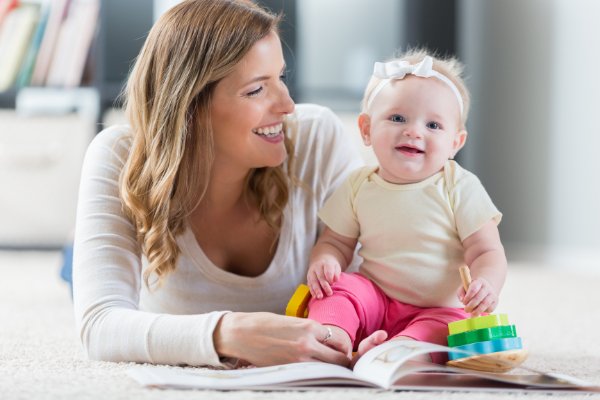 mom and baby with book